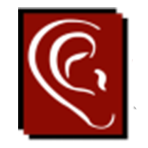 An audiologist fitting a patient with hearing aids in Stevens, PA.